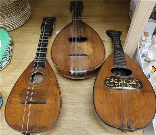 A 19th century French mandolin, with rosewood press in pegs, a later 19th century Mandolin with watch key tuning